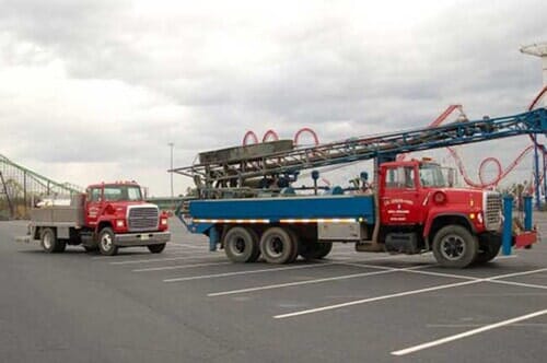 Two Red Trucks in a Parking Lot - Well Drilling in Browns Mills, NJ
