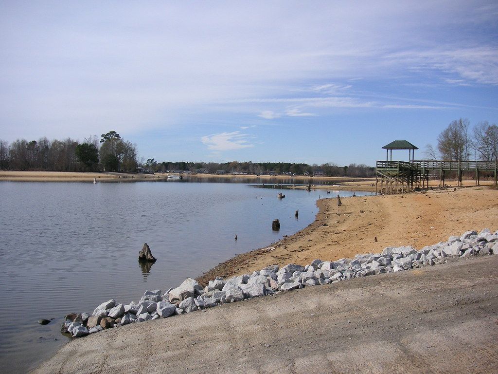 Lake Marion in Summerton, SC, with calm water and boats docked near the shoreline