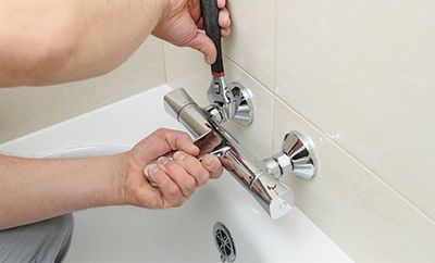 Bathroom Plumbing — Installing Faucet with Thermostat in Jonesboro, GA