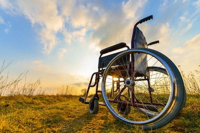 wheelchair with a sunset in the background