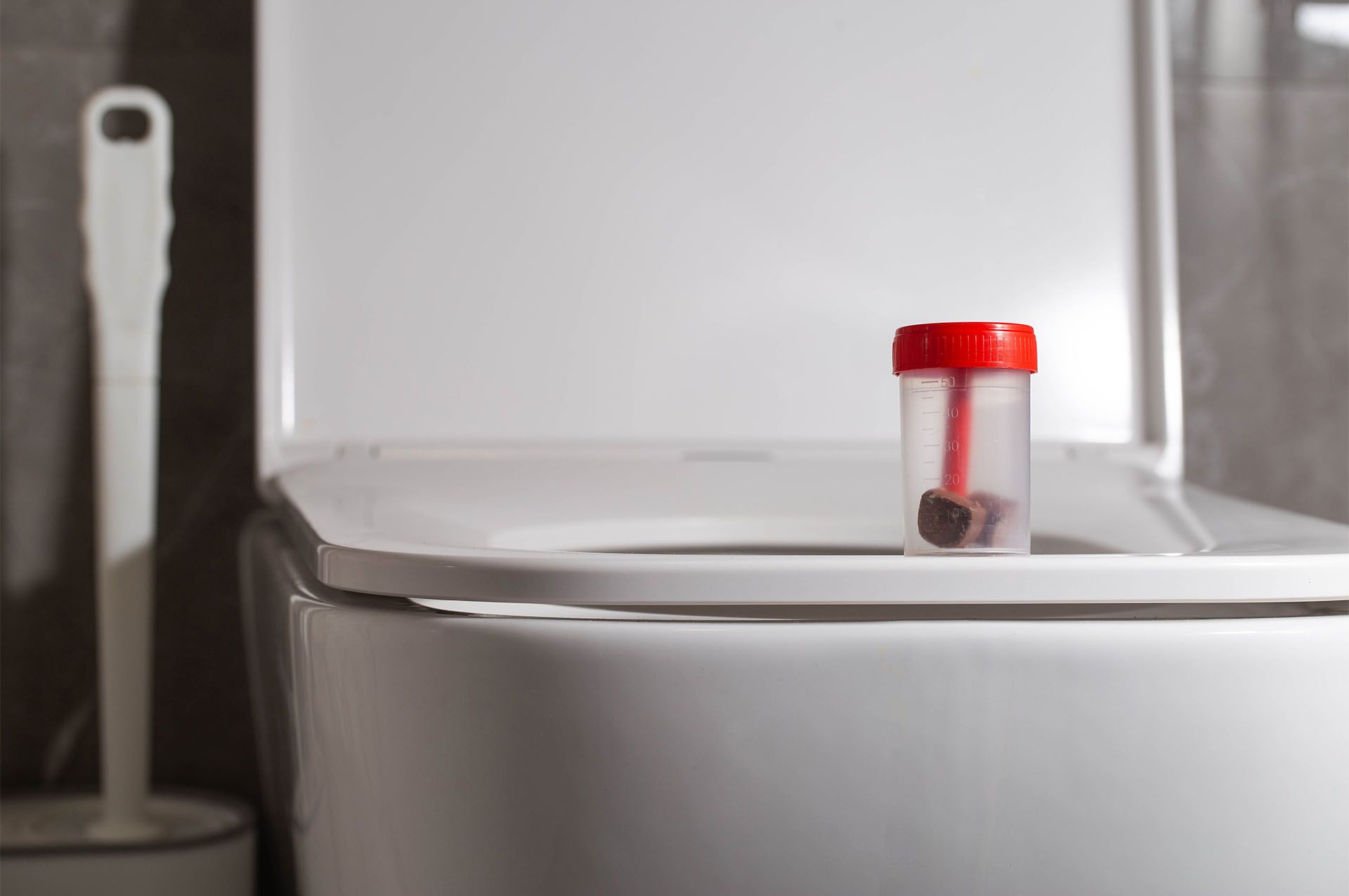 Stool sample container used to check for blood in stool