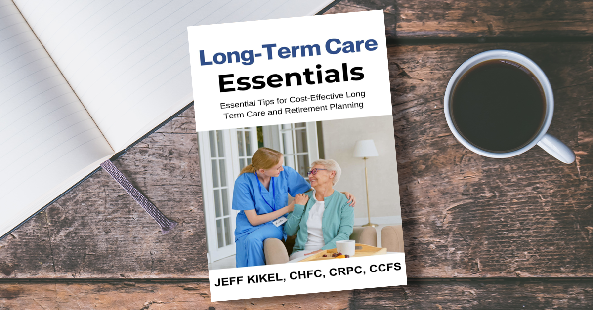 A book titled long-term care essentials is sitting on a wooden table next to a cup of coffee.