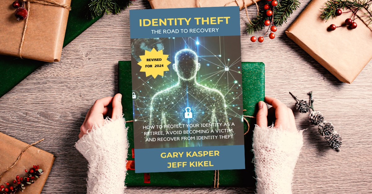 A person is holding a book titled identity theft.