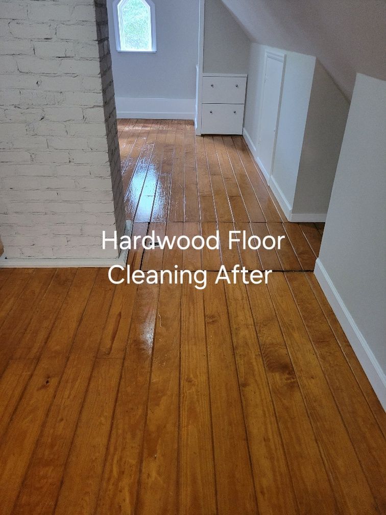 A hardwood floor is being cleaned in a room.
