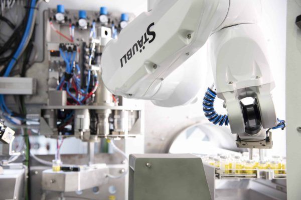 A robotic arm with the word Stäubli on it