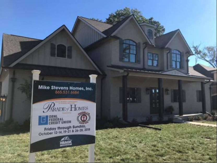 Historic house with a sign reading “Milo Stevens Home, Inc.” in the front yard.