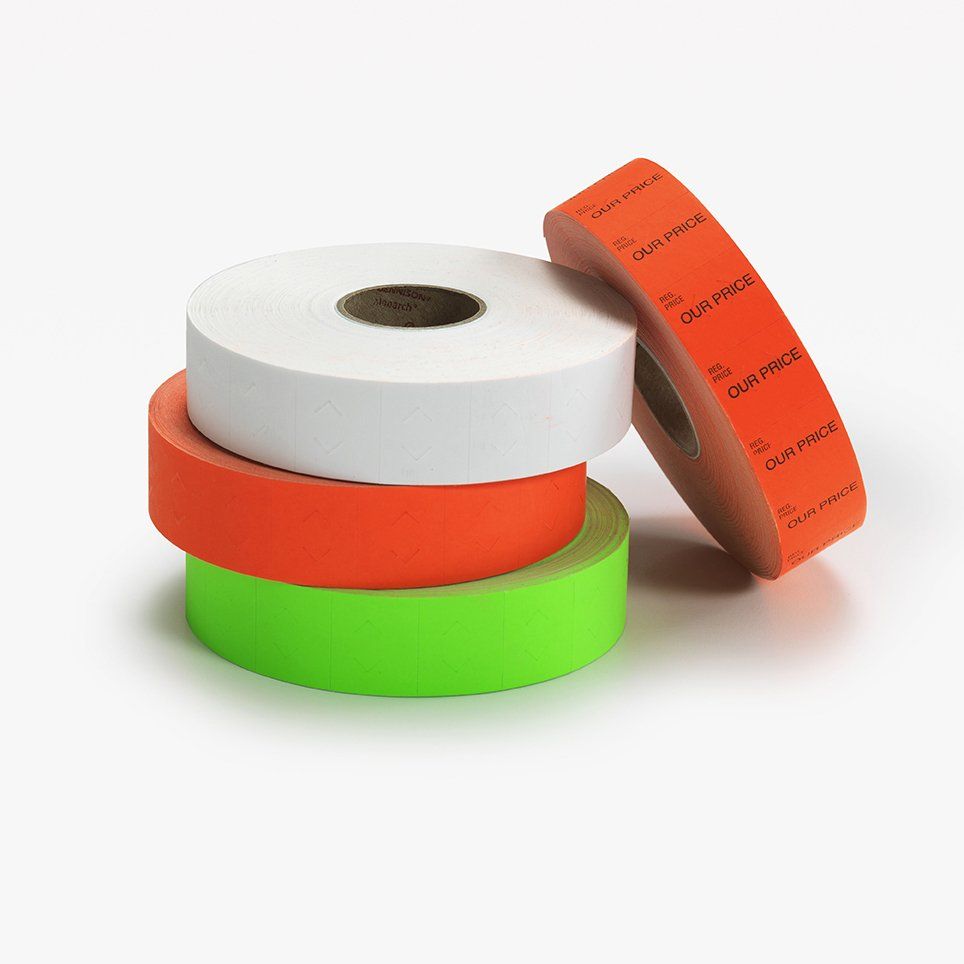 Three rolls of different colored labels are stacked on top of each other on a white surface.