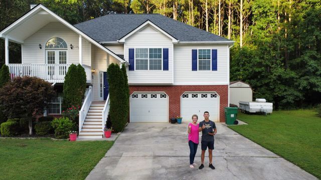 House with couple - Woodstock, GA | MTak Roofing Systems