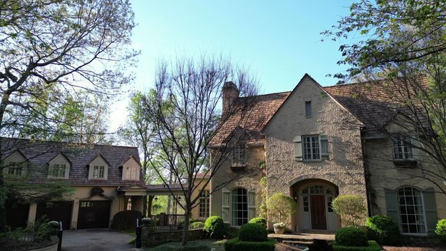 House beside tree without leaves - Woodstock, GA | MTak Roofing Systems