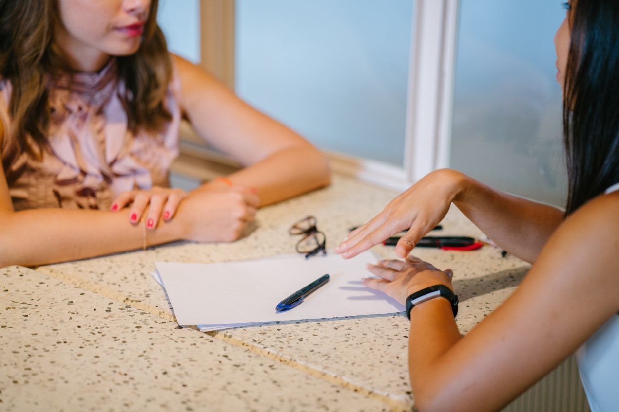 Property Consultation Between Two Woman - Surveying In Coffs Harbour NSW