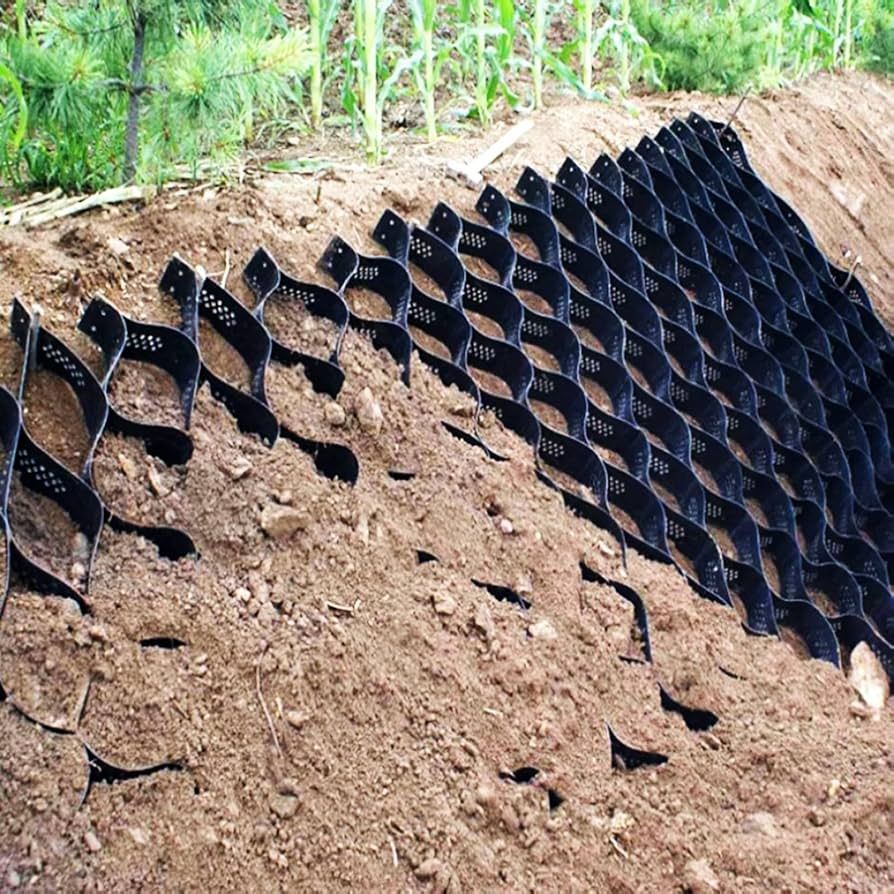 Top’em & Drop’em laid erosion control grid on a steep slope to stop washouts and soil loss in Orange City, FL.