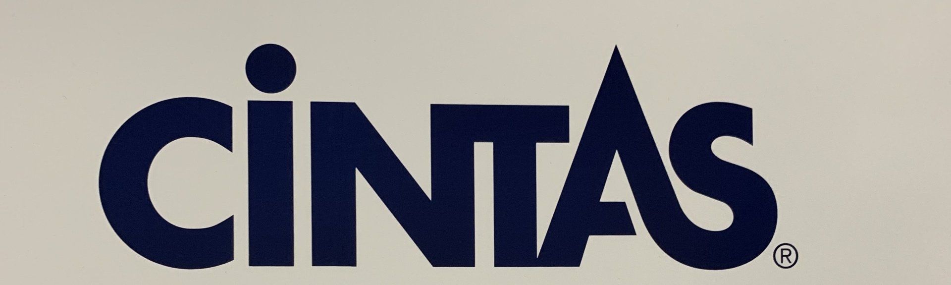 The word cintas is on a white background