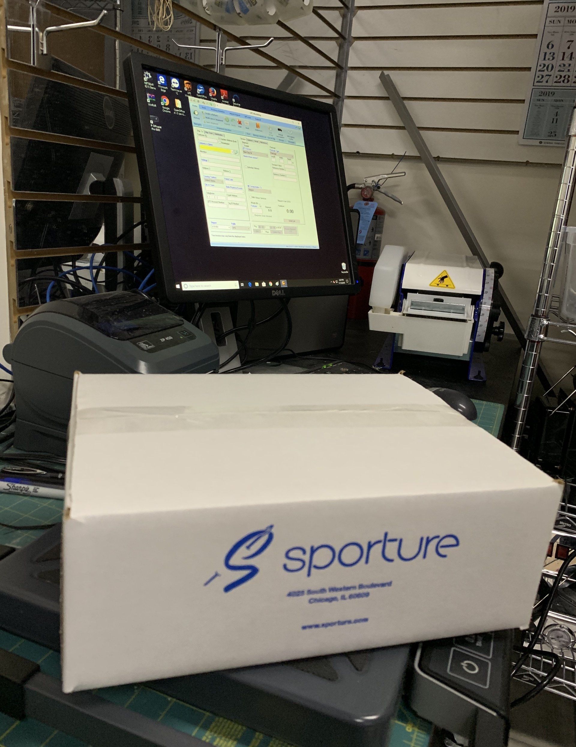 A white box with the word sporture on it