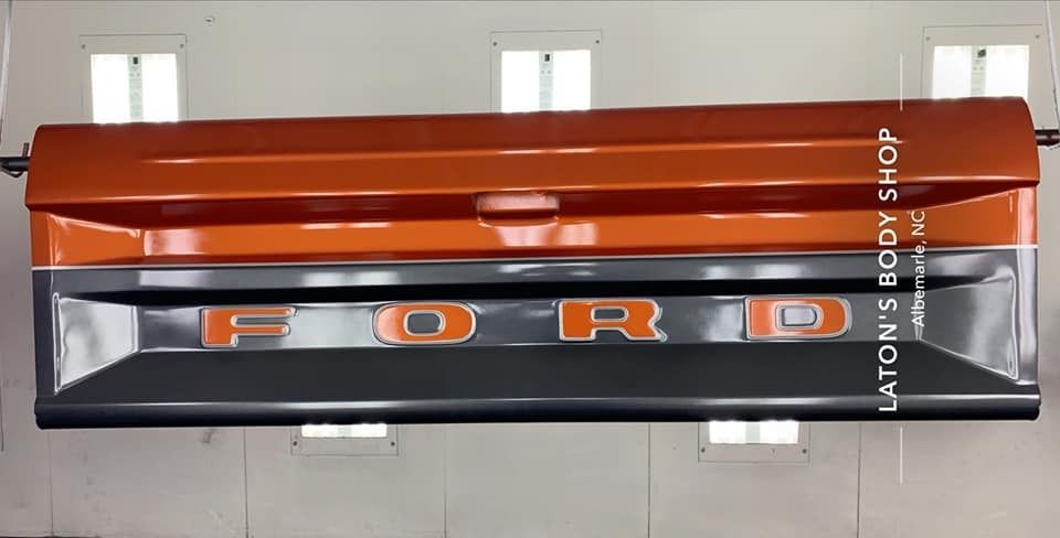 Orange and gray Ford truck tailgate with 