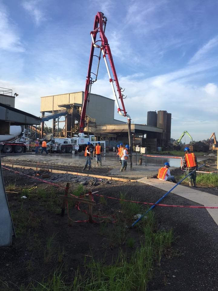 A group of construction workers are working on a construction site.