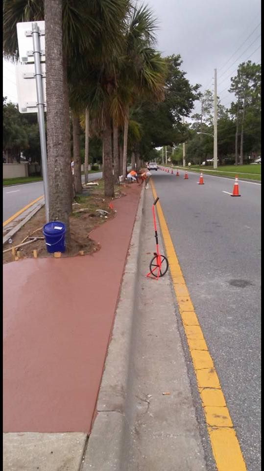 A scooter is parked on the side of the road