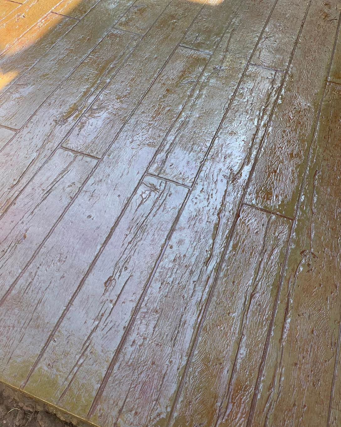 A close up of a concrete floor that looks like wood.