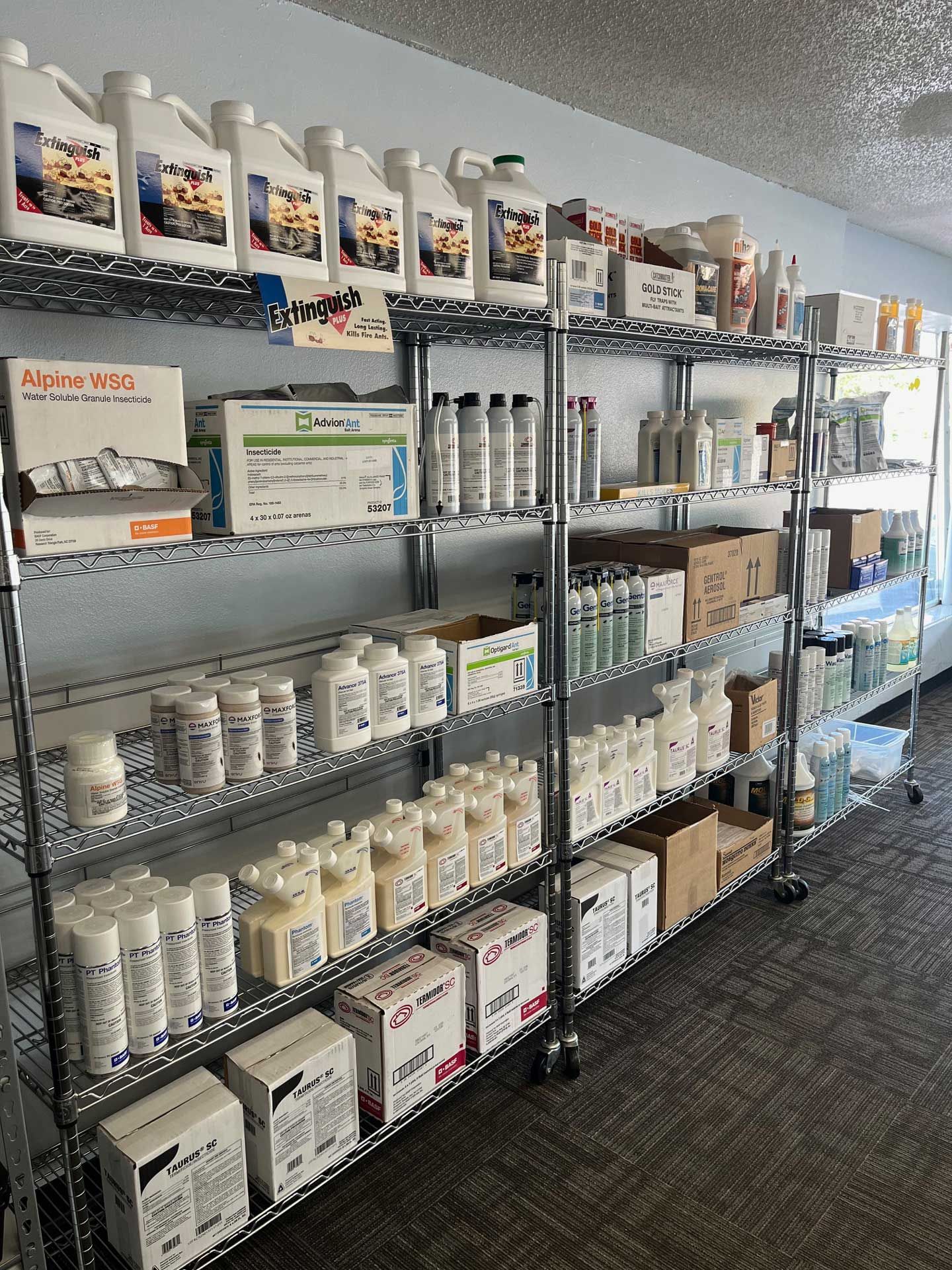A room filled with shelves filled with lots of bottles and boxes.
