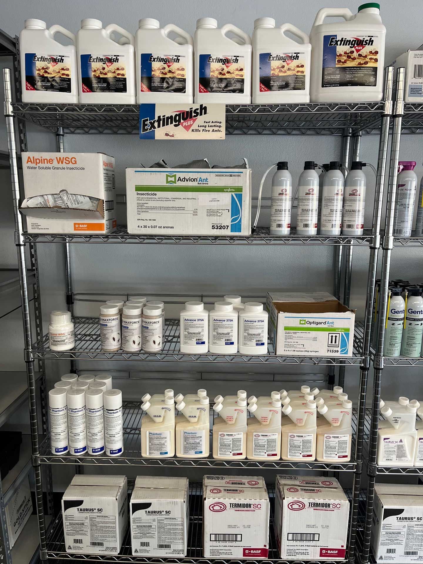 A shelf filled with lots of bottles and boxes of chemicals.