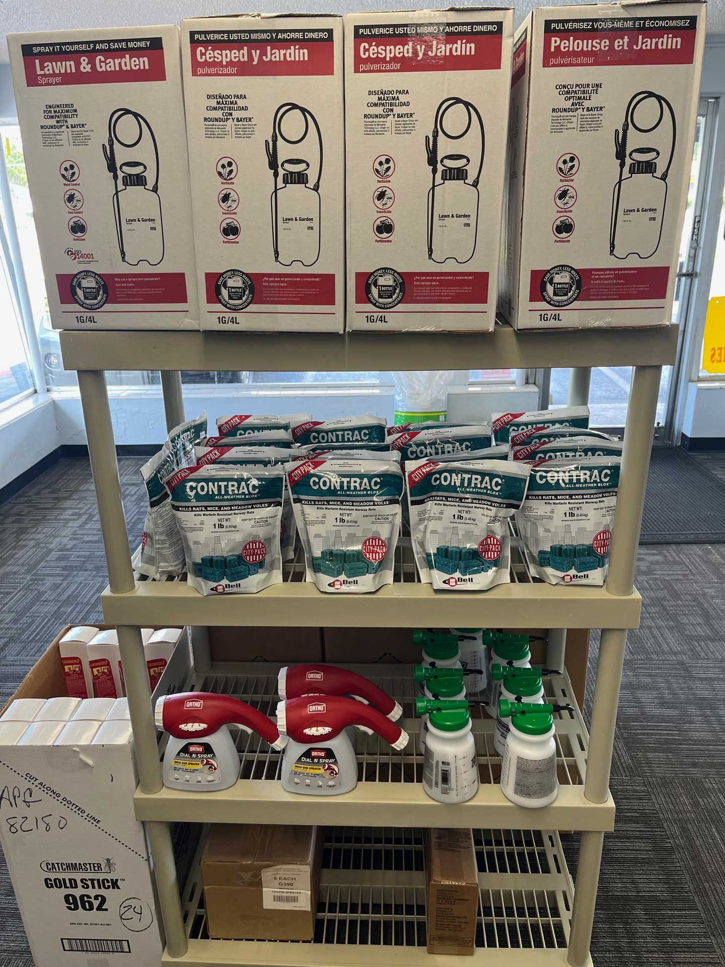 A shelf filled with boxes and bottles of products in a store.