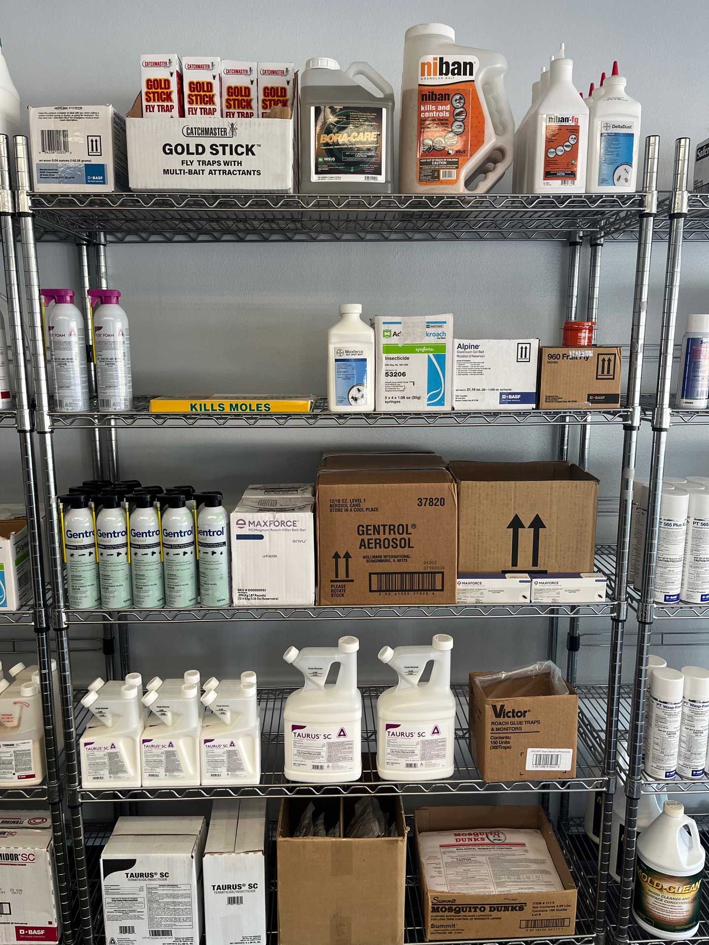 A shelf filled with lots of bottles and boxes of chemicals.