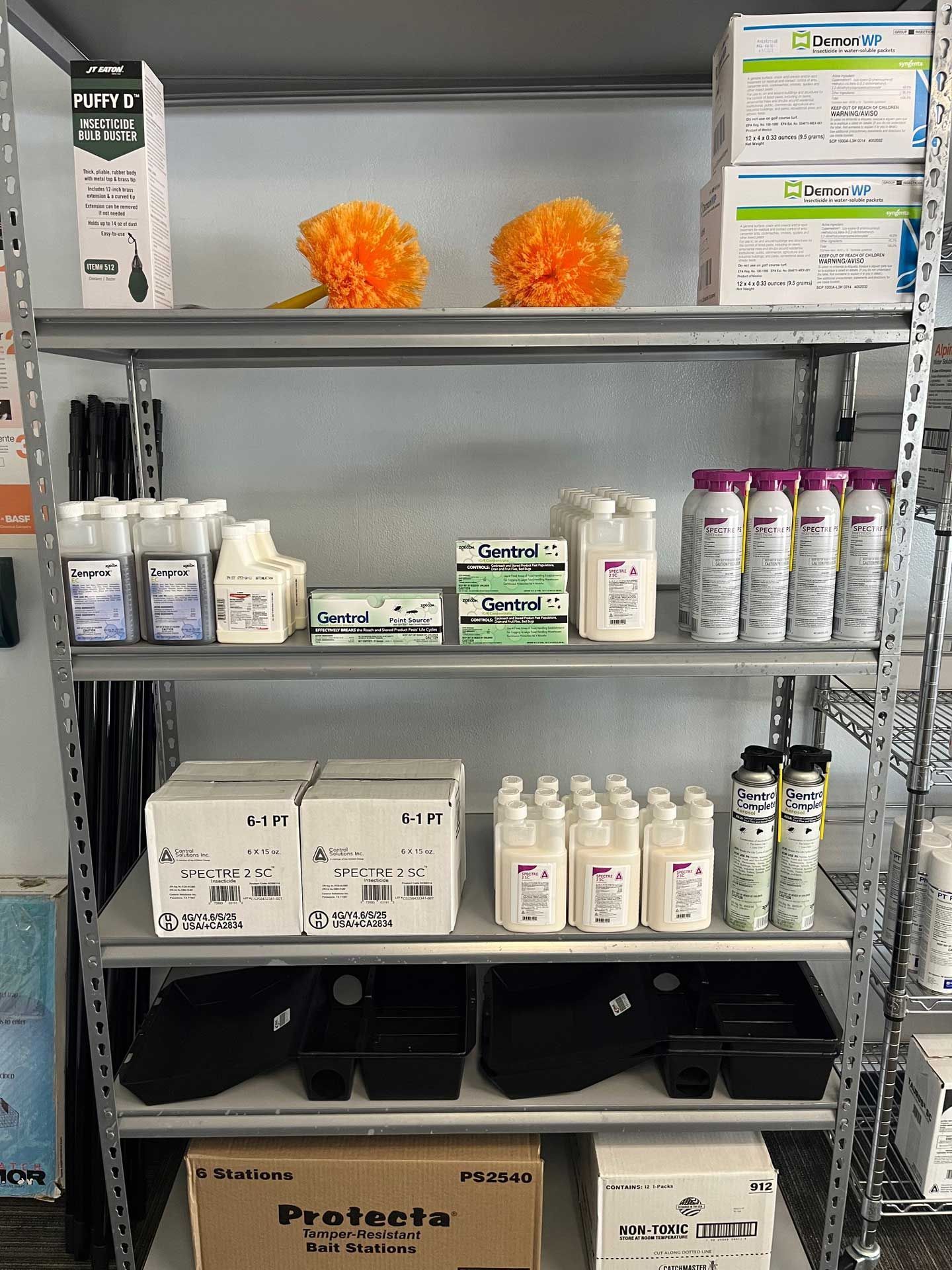 A shelf filled with lots of bottles and boxes.