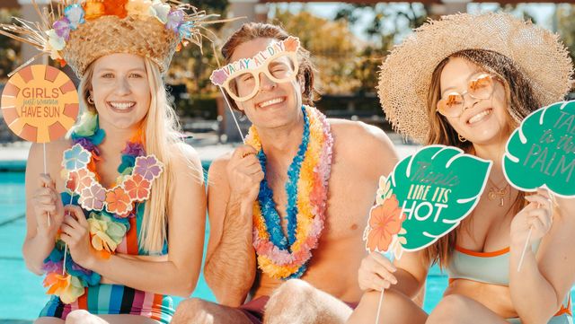 A group of people are posing for a picture in a swimming pool.