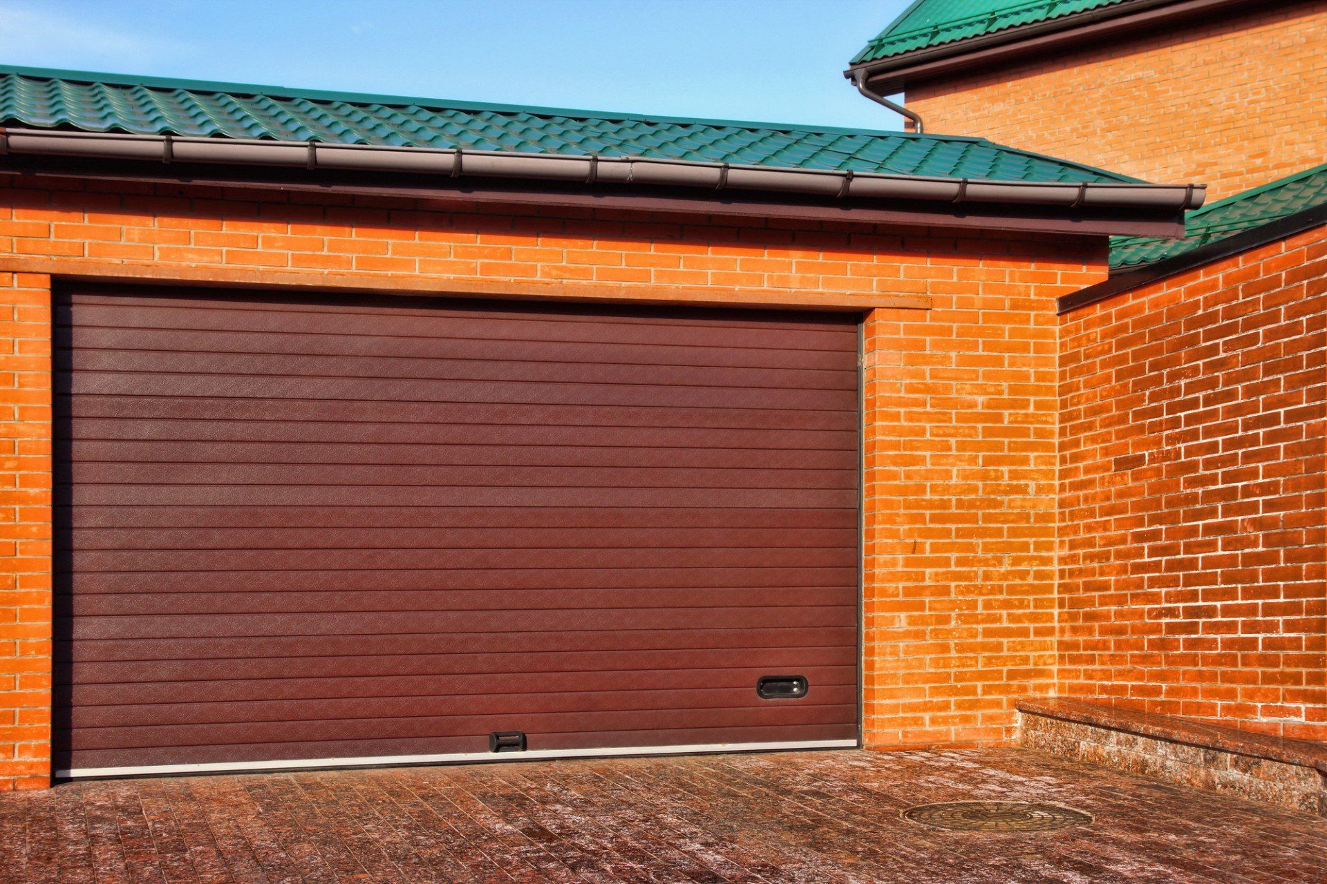 a brown garage door newly installed
