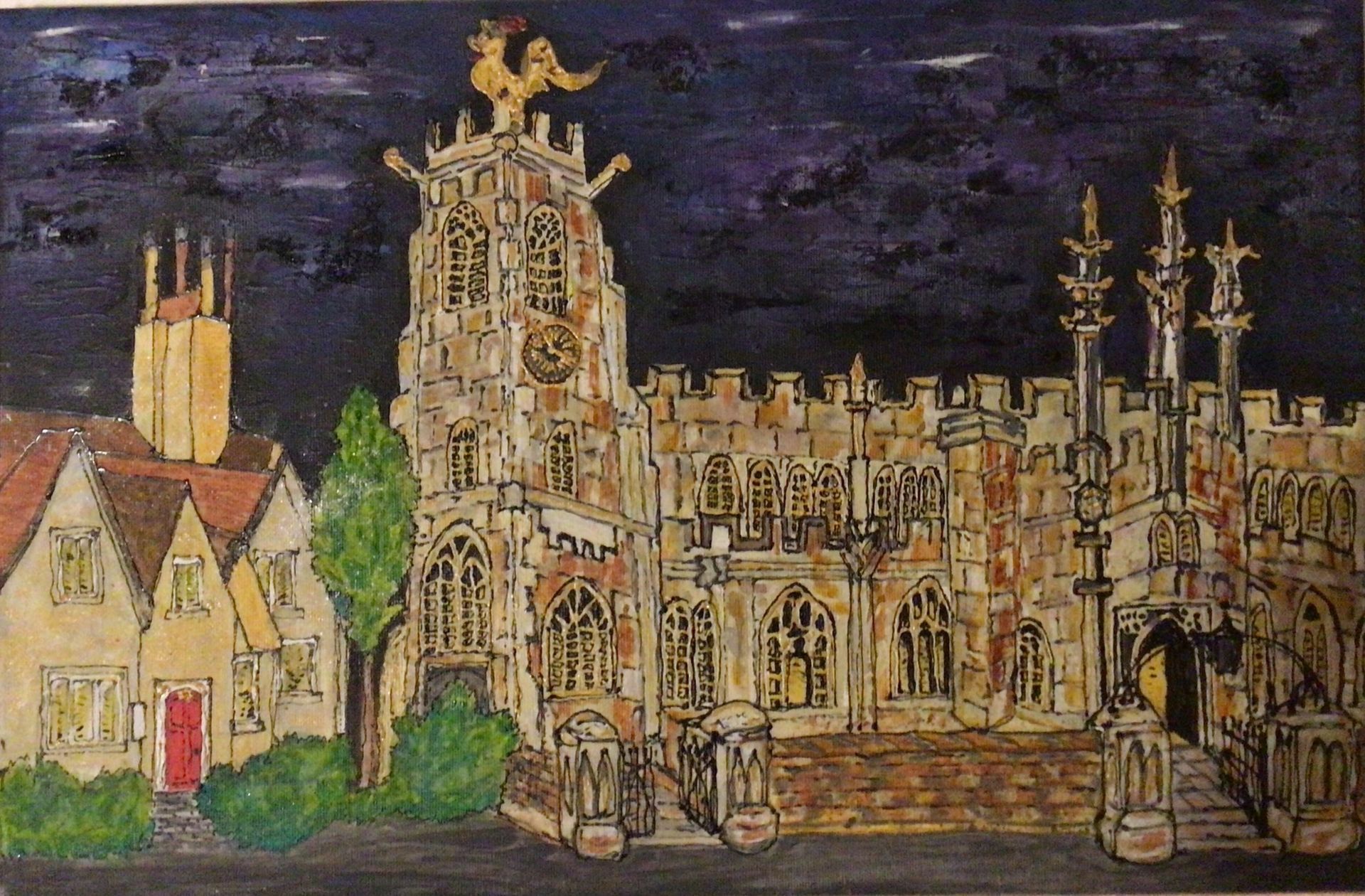 Church and buildings at night, with illuminated windows and a black sky.