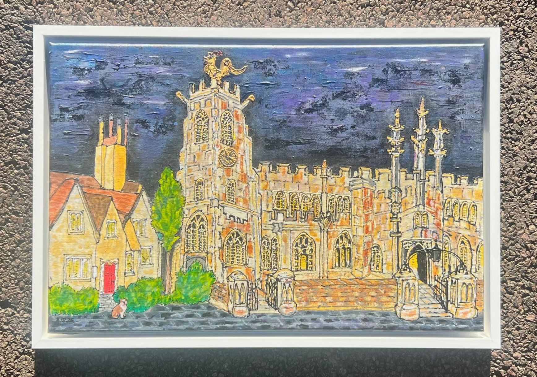 Colorful illustration of a row of buildings along a winding road, framed in black. Blue sky backdrop.