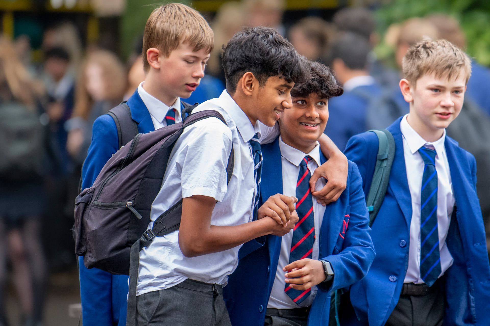 A boy and a girl are playing with a water fountain.