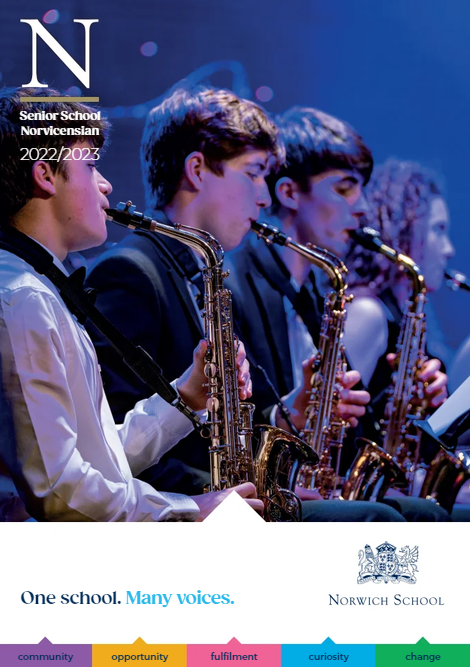 A group of young men are playing saxophones in an orchestra.