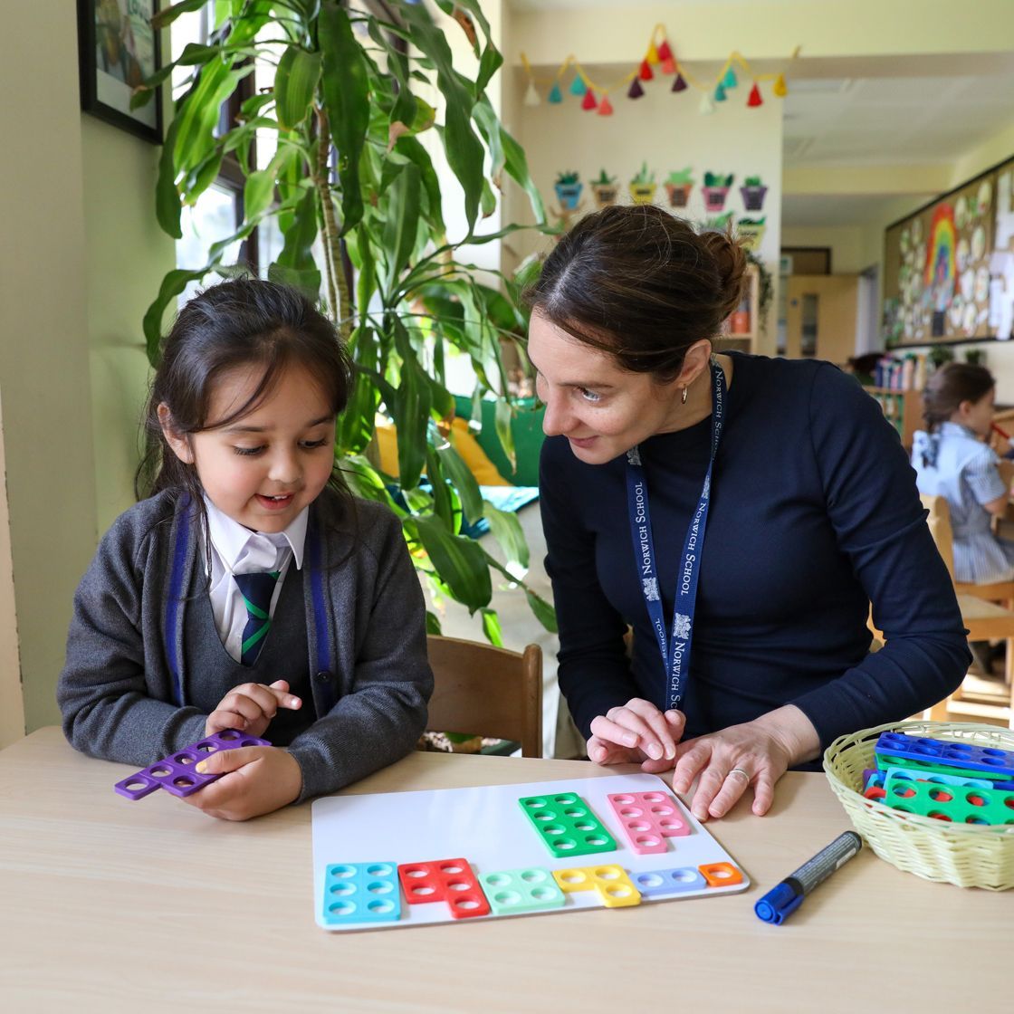 A pupil with a teacher in pre-reception.