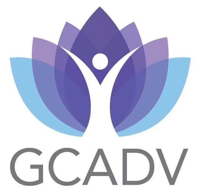 Lotus flower with person shape reaching up, GCADV logo.