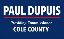 Paul Dupuis campaign sign on blue background: “Presiding Commissioner COLE COUNTY”