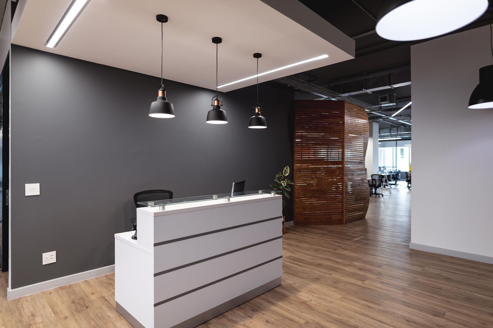 There is a reception desk in the middle of the room.