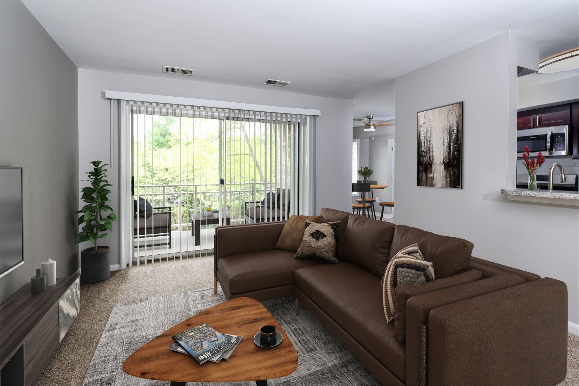 Living room with a brown sectional sofa, coffee table, and sliding glass doors to the balcony.