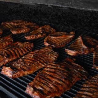 racks of ribs on smoker