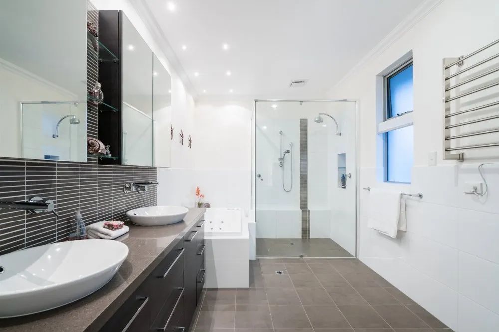 A Bathroom with Two Sinks and A Walk in Shower — Affordable Tiling & Waterproofing in Kirwan, QLD