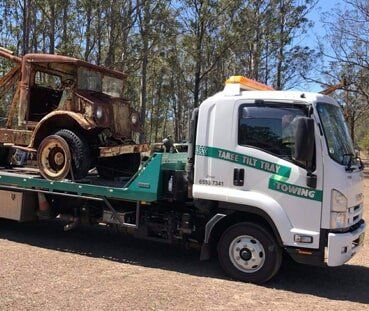 Truck Loaded With Ruined Car — Emergency Towing in Taree, NSW