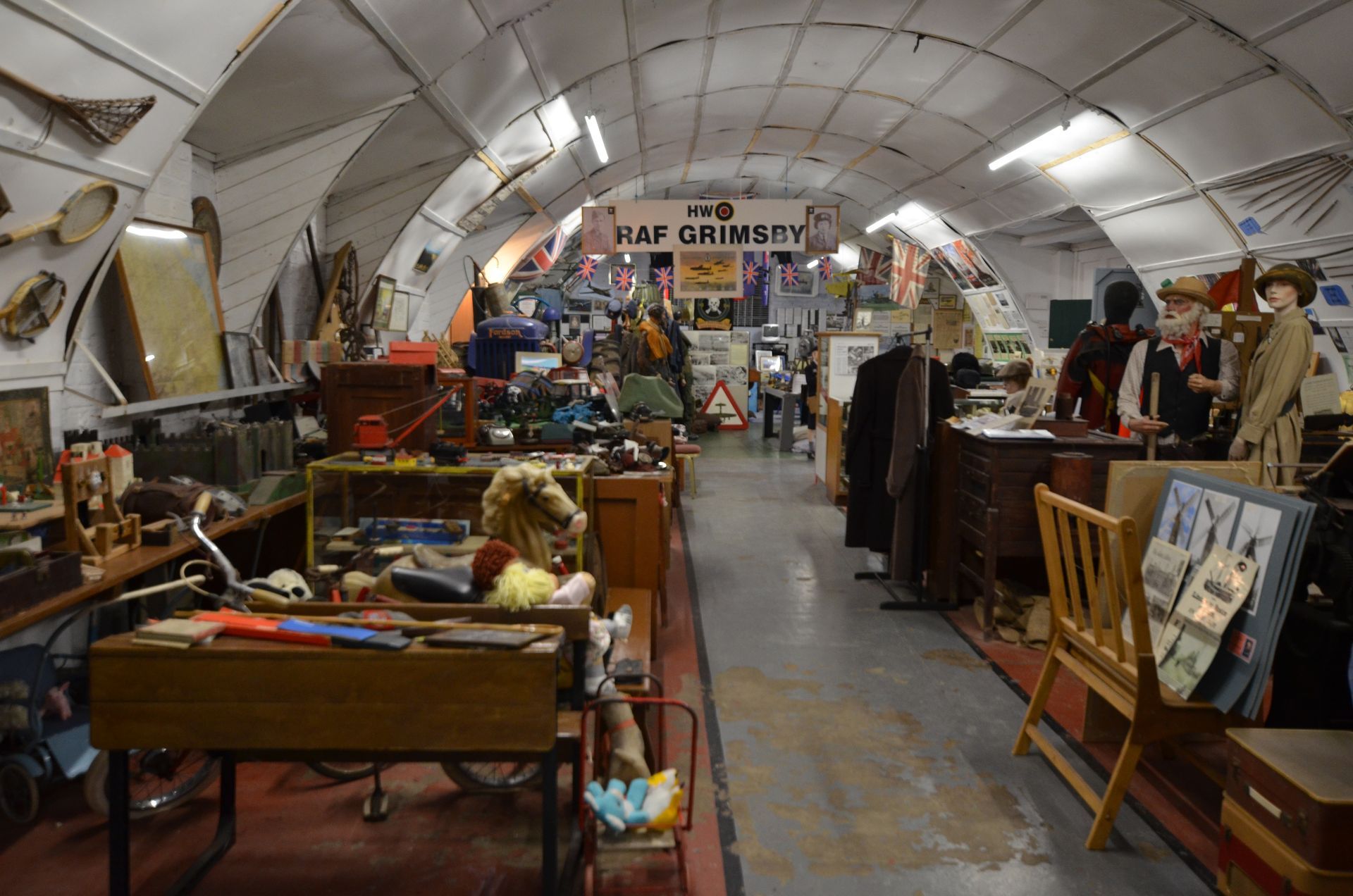 A room filled with lots of objects and a sign that says raf grimsby