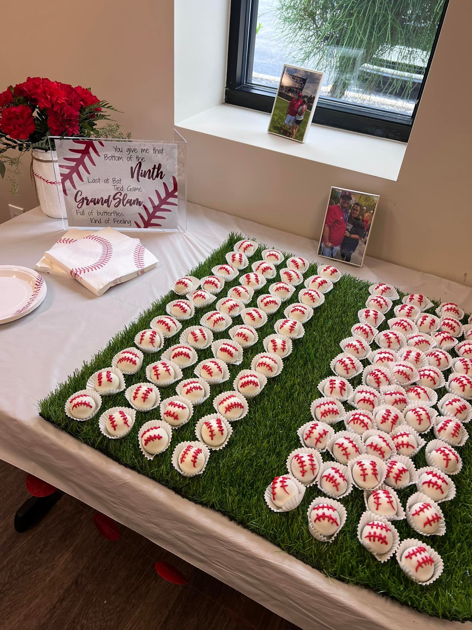 A table topped with cupcakes decorated to look like baseballs.