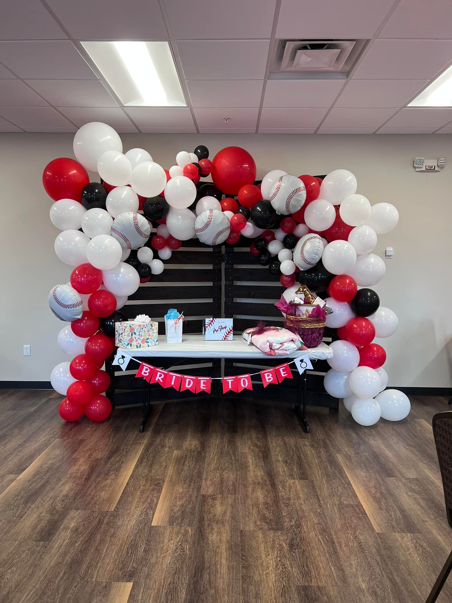 A group of women are toasting with champagne glasses at a bachelorette party.