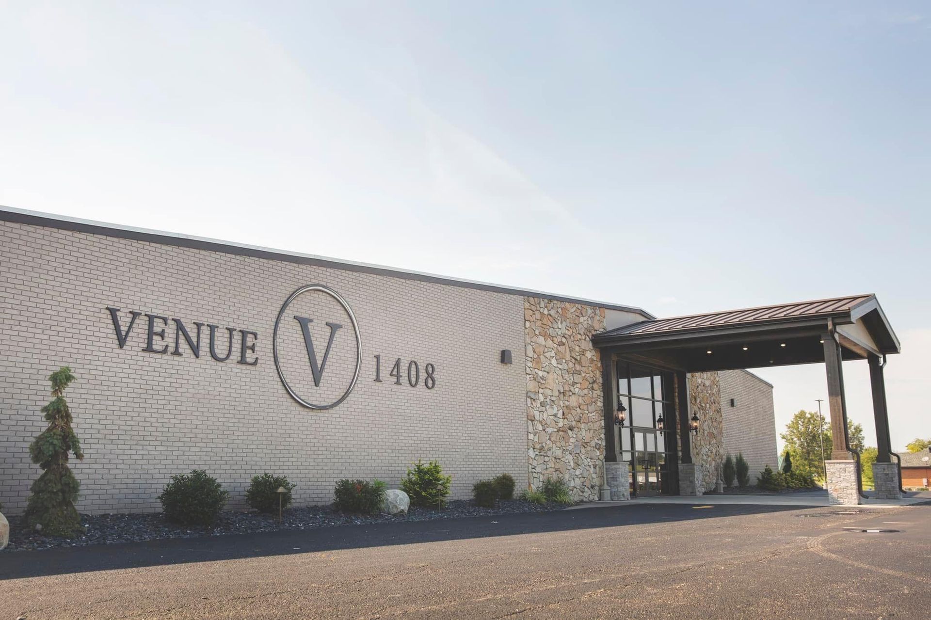 A large white building with the word venue on it.