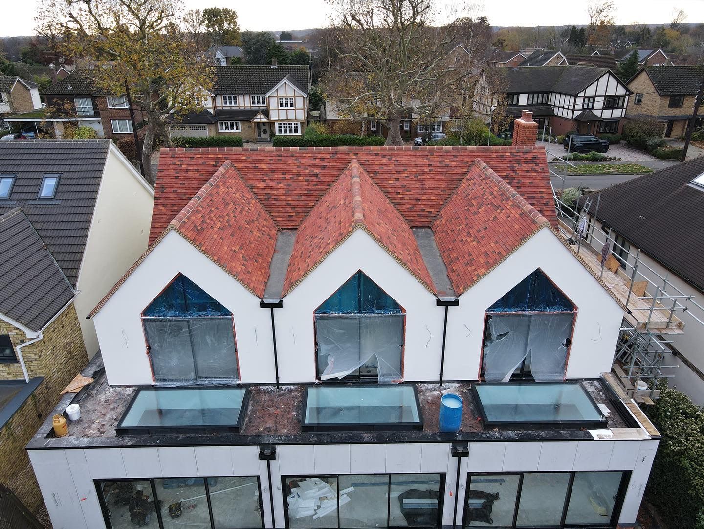 Handmade clay plain tiles on modern large home single development