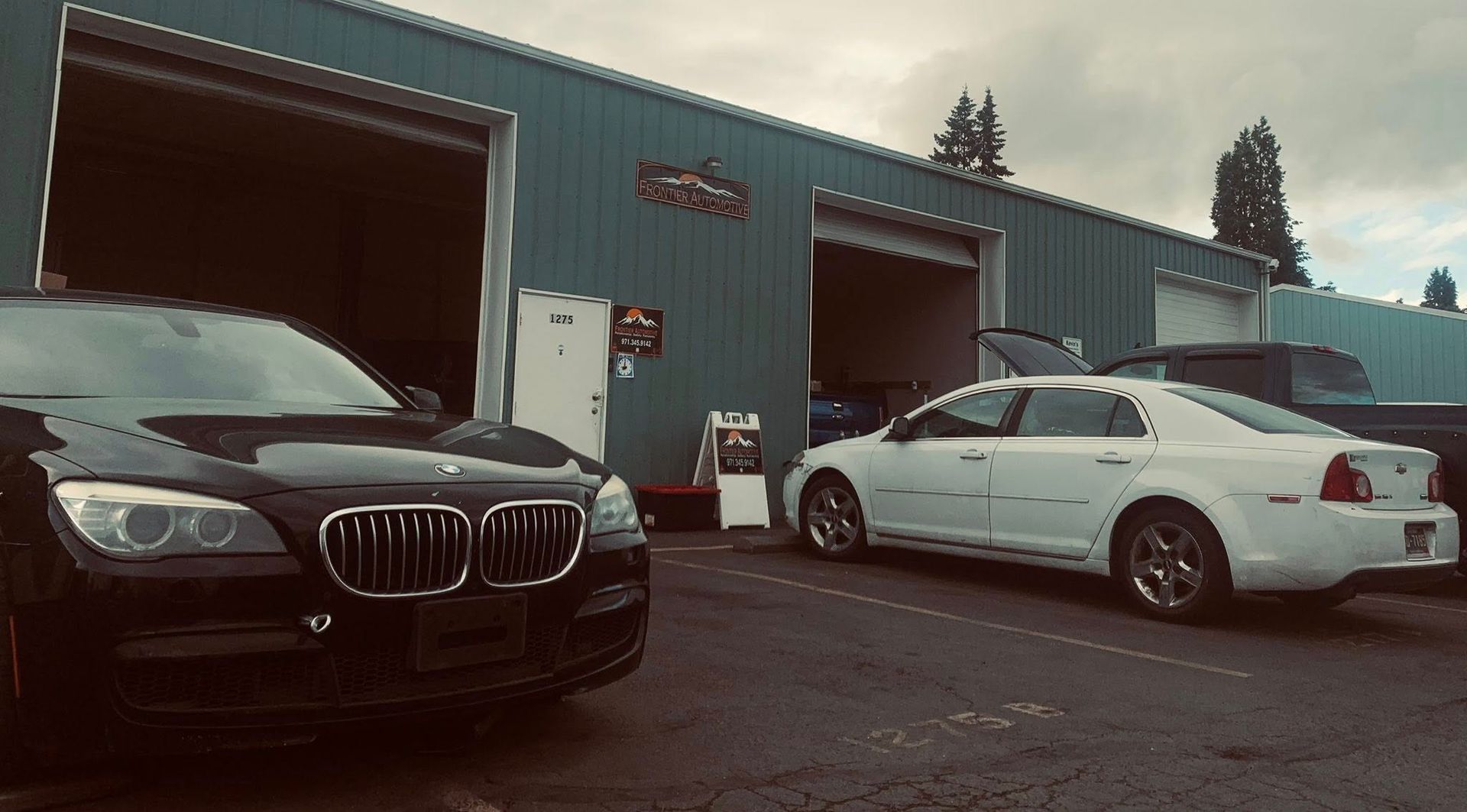Vehicles Parked Outside Local Auto Repair Shop Facility | Frontier Automotive