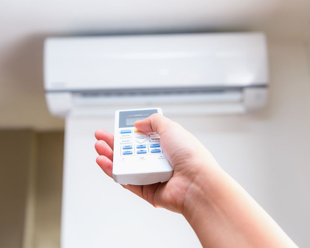 Operating Air Conditioner with Remote Control — Pelham, NH — Accu-Tek Appliance & Air Conditioning