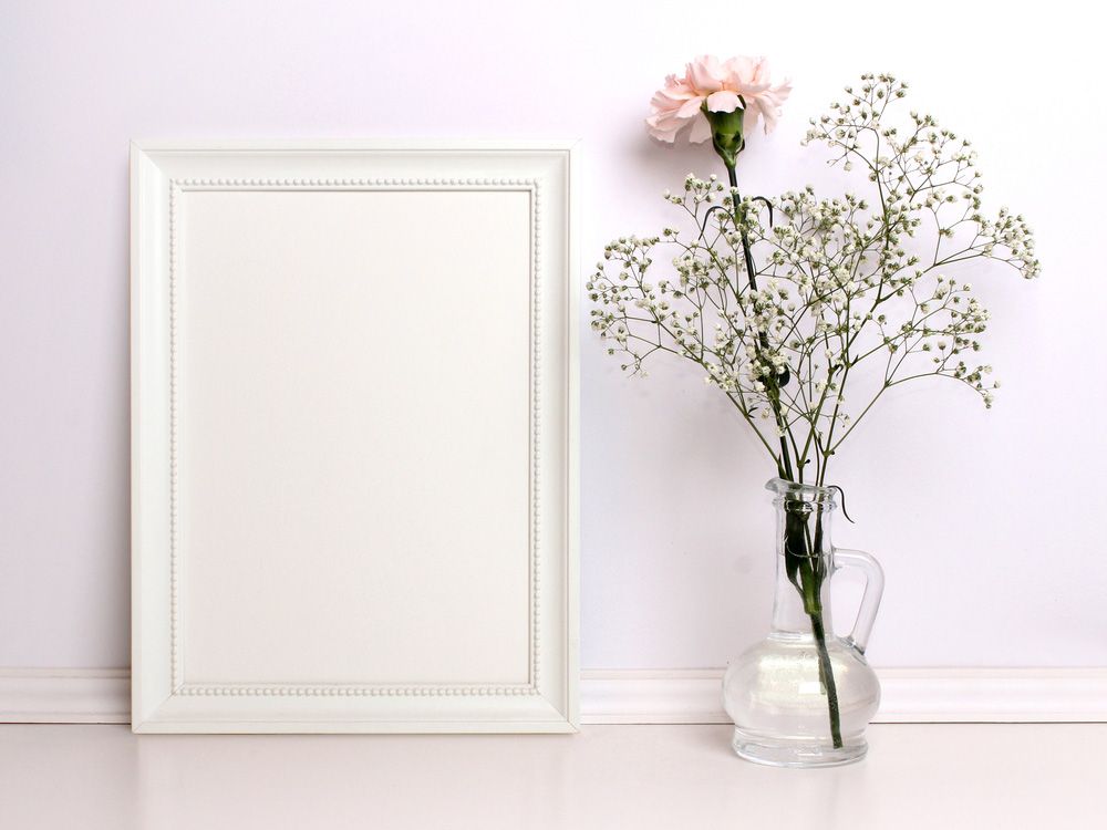 There Is a Picture Frame and A Vase with Flowers in It — The Framer In Taree, NSW