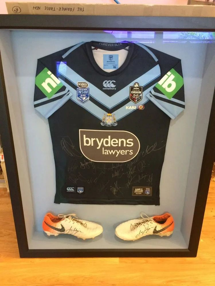A Framed Jersey with A Brydens Lawyers Logo on It — The Framer In Taree, NSW