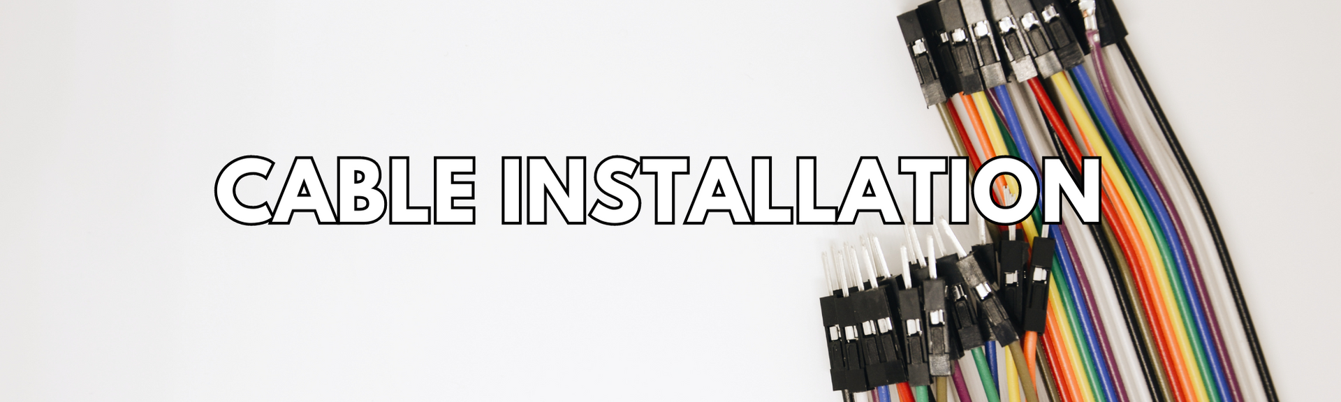 A white background with small cables neatly lined up on the right side. “Cable Installation” is written over it.